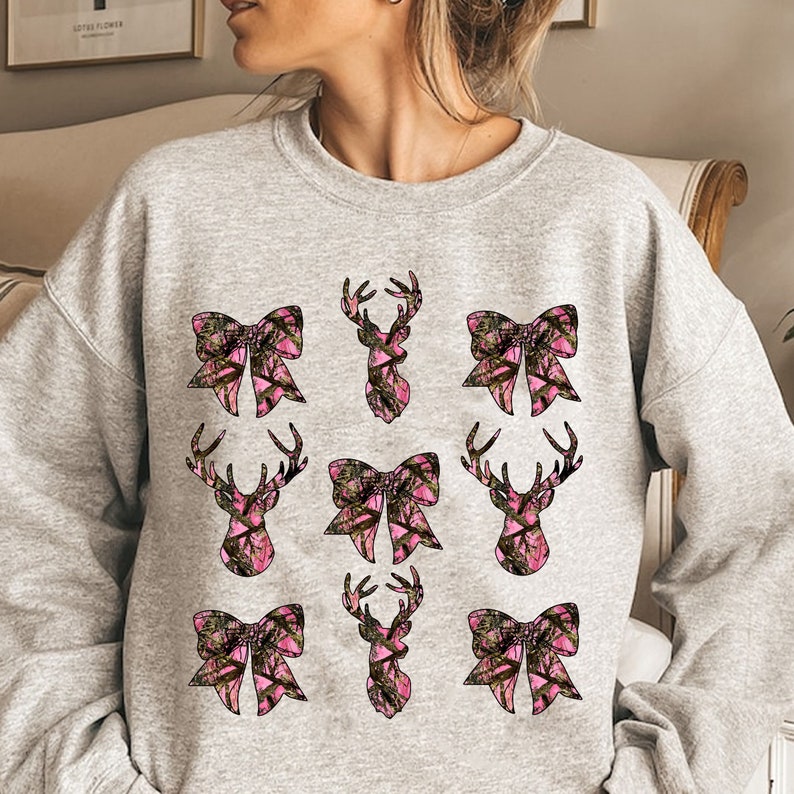 a woman wearing a sweatshirt with a bow on it