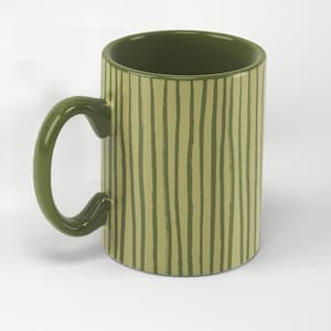 May include: A ceramic mug with a green handle and interior. The exterior features vertical, uneven stripes in a lighter shade of green against a darker green background. The mug is designed for hot or cold beverages.