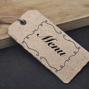 May include: A brown paper tag with a decorative border and the word "Menu" written in cursive.