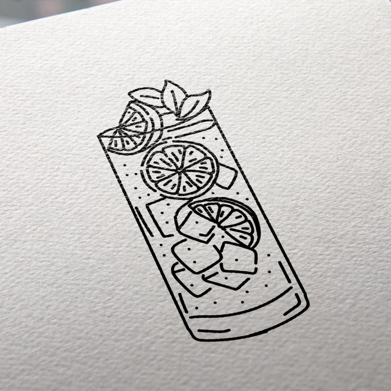 May include: Black and white line drawing of a tall glass filled with ice cubes, lemon slices, and a sprig of mint.