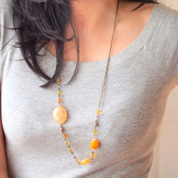 Statement long necklace in Orange, Yellow, Blond assorted on two thin antique brass chain