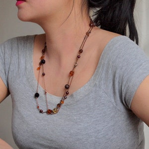 Black and orange long necklace in antique copper chain image 1