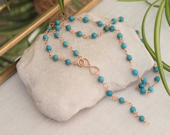 turquoise chain wirewrapped, rosario style with infinity symbol, length of 47 cm