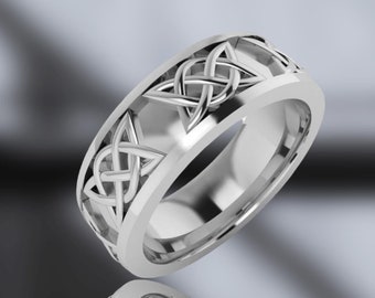 May include: A silver Celtic knot wedding band with a detailed design. The band is wide and has a polished finish.