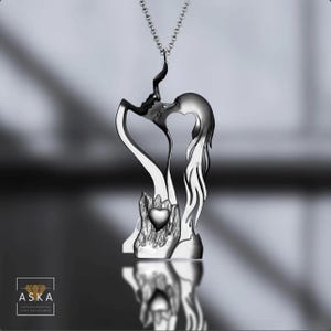 Sterling Silver Lovers Kiss Pendant: Romantic Heart Necklace