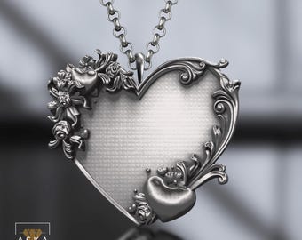 May include: A silver heart-shaped pendant necklace with intricate floral designs and a delicate chain. The pendant features a smooth, blank surface in the center, perfect for engraving or adding a personal touch.
