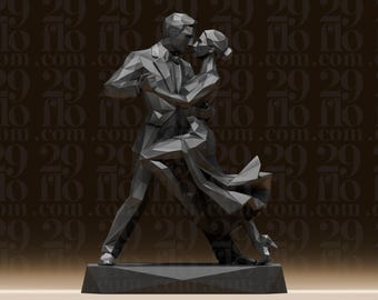May include: A geometric sculpture of a couple dancing the tango. The figures are rendered in shades of grey, with sharp angles and facets. The male figure wears a suit and bow tie, while the female figure has a flowing dress. The sculpture is mounted on a rectangular base.