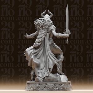 May include: A detailed gray figurine of a warrior woman, holding a large sword. She wears a horned helmet, cape, and armor. The figure is standing on a decorative base with carved patterns. The background has a repeating pattern of the text "flo.com".