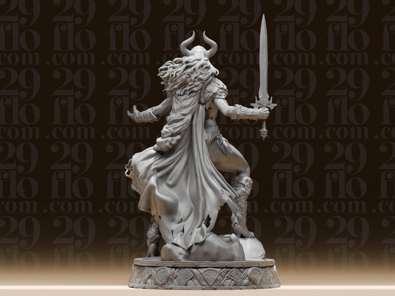 May include: A detailed gray figurine of a warrior woman, holding a large sword. She wears a horned helmet, cape, and armor. The figure is standing on a decorative base with carved patterns. The background has a repeating pattern of the text "flo.com".