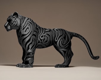 May include: A black, intricately patterned tiger sculpture. The tiger is standing on all four legs with its tail curled behind it.