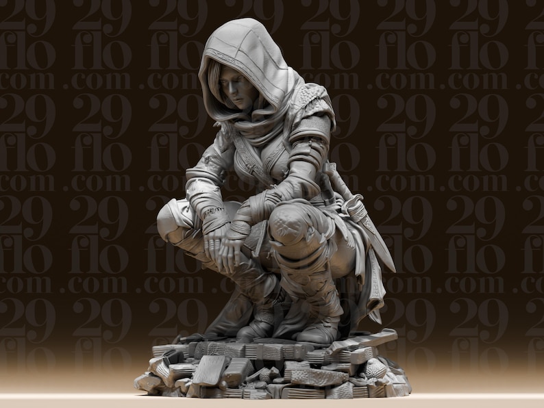 May include: A detailed grey figurine of a hooded figure in a crouching position, wearing armour and holding a knife. The figure is kneeling on a pile of stone rubble, with intricate details in the clothing and pose.