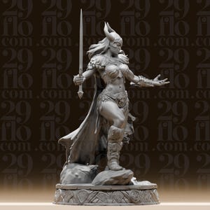 May include: A detailed gray figurine of a warrior woman, holding a sword aloft. She wears a horned helmet, armor, and a flowing cape. The figure stands on a decorative base, with the text "flo" repeated in the background.