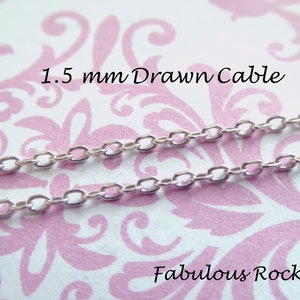 May include: Close-up of a silver 1.5 mm drawn cable chain on a pink and white patterned background. The text "Fabulous Rocks" is visible at the bottom of the image.