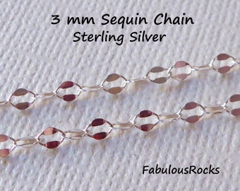 May include: A close-up of a 3 mm silver sequin chain. The chain is made of sterling silver and has a delicate, feminine look. The chain is shown on a white background.