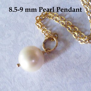 May include: A white pearl pendant on a gold chain. The pearl is 8.5-9 mm in diameter.