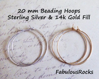 May include: Two 20 mm beading hoops, one sterling silver and one 14k gold fill.  The hoops are shown on a white background with handwritten text.
