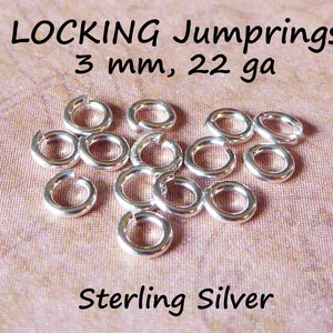 May include: A close-up of a pile of silver locking jump rings. The rings are 3 mm in diameter and 22 gauge. The text "LOCKING Jumprings 3 mm, 22 ga Sterling Silver" is visible in the image.