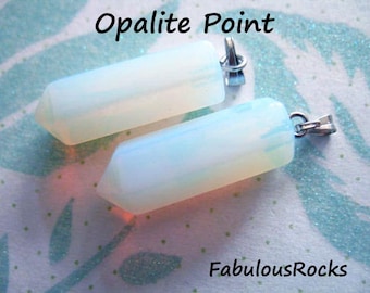 May include: Two opalite point pendants with silver jump rings. The opalite is translucent and has a milky white colour. The pendants are on a white background with a blue and white pattern.