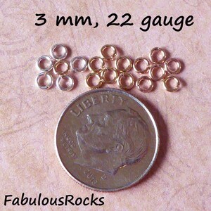 May include: A close-up of a pile of 3 mm, 22 gauge jump rings. The rings are silver and gold in color. A US dime is shown for size comparison.