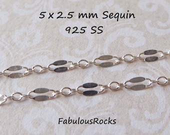May include: Close-up of a silver chain with 5 x 2.5 mm oval-shaped links. The chain is made of 925 sterling silver. The text "5 x 2.5 mm Sequin 925 SS" is visible at the top of the image. The text "FabulousRocks" is visible at the bottom of the image.