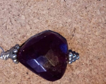 Huge ruby bead and silver pendant.
