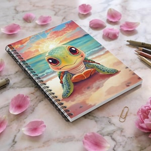 May include: Spiral-bound notebook featuring a cartoon sea turtle on a beach scene with a sunset backdrop. The turtle has a green shell, orange accents, and large, expressive eyes. Pink flower petals surround the notebook.