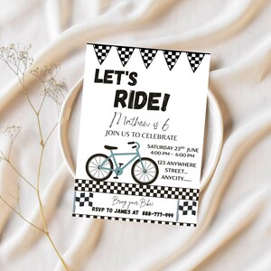 May include: A white invitation card with the text "LET'S RIDE!" and a bicycle illustration. The invitation is for Mathew's 6th birthday, with event details including the date, time, and location. The card has black and white checkered flag borders.