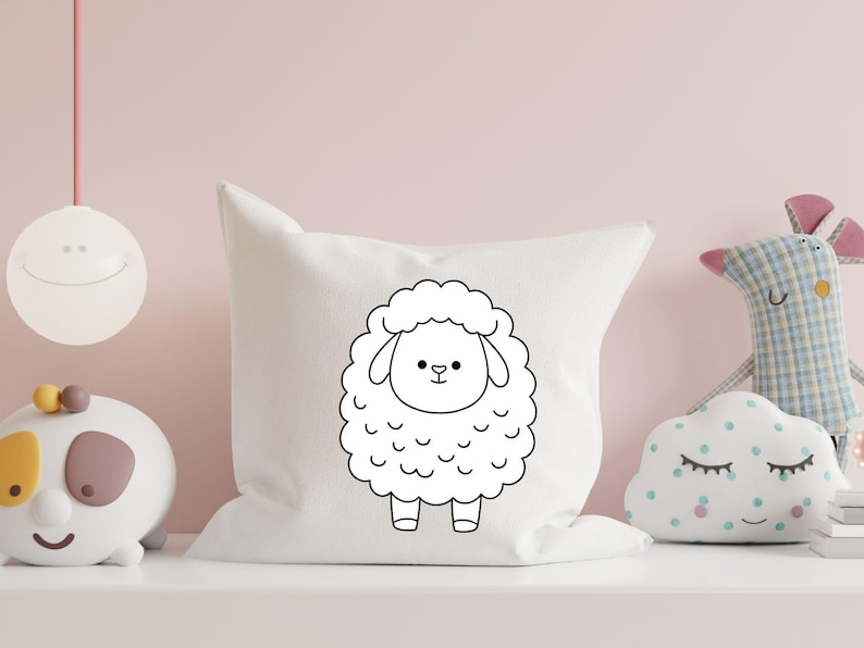 May include: A white pillow with a black outline of a cartoon sheep on it. The sheep has a simple face with two eyes, a nose, and a mouth.