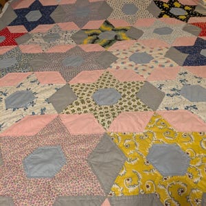 Antique Handmade 5 Point Star Patchwork Quilt. Hand Pieced and quilted. Full size with great fabric in soft colors.