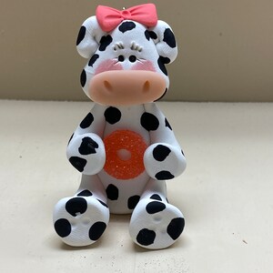 Cow with a candy ornament