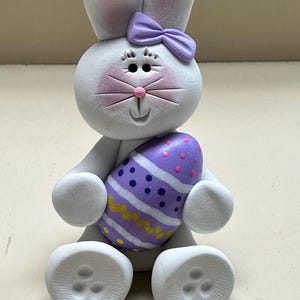 Bunny with a purple Easter egg