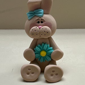 Tan bunny with a flower