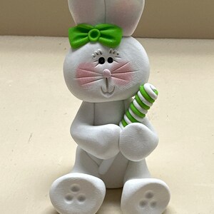 Bunny with a green sucker