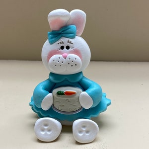 Girl bunny with a carrot cake