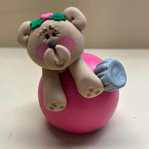 Teddy bear on a Christmas bulb decoration