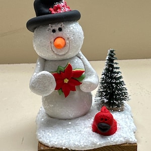 Snowman with a cardinal decoration