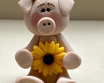 Pig with a sunflower