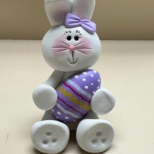 Bunny with a purple Easter egg