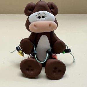 Hereford cow with lights ornament
