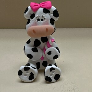 Cow with a candy ornament