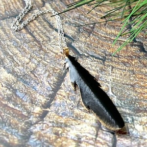Raven or crow brass feather pendant style necklace on sterling silver chain