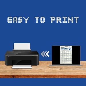 May include: A black printer on a wooden table with a laptop displaying a printable 30-day journaling challenge. The text "EASY TO PRINT" is displayed above the printer and laptop.