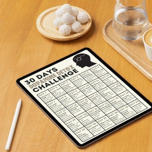 May include: A digital tablet displaying a 30-day dopamine detox challenge. The challenge includes daily activities such as no social media, no screen time, and mindful meditation.