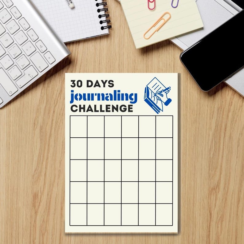 May include: A white printable 30-day journaling challenge tracker with a blue and white illustration of a hand writing in a book. The text "30 DAYS journaling CHALLENGE" is printed in blue.