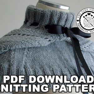 May include: A gray knitted cowl with a black ribbon tied around the neck. The cowl has a lace pattern and is on a white background. The text "PDF DOWNLOAD KNITTING PATTERN" is at the bottom of the image. The text "THE JANE VICTORIA" is in a circle with a heart and knitting needles.