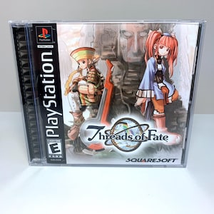 May include: PlayStation game case for 7 Threads of Fate, a role-playing game by SquareSoft. The case features a colorful illustration of two characters, a young girl with red hair and a young boy with brown hair, standing in front of a stone structure. The game is rated E for Everyone by the ESRB.