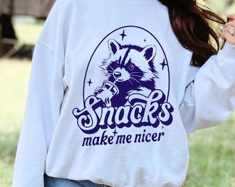 Funny Raccoon Snacks Make Me Nicer sweatshirt, Cute Animal Foodie Tee, Funny Raccoon Meme Shirt, Retro Vintage Snack Lover sweatshirt