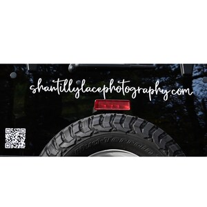 May include: A black Jeep with a white "shantillylacephotography.com" sticker on the back. The Jeep has a spare tire and a red taillight. A QR code is visible on the left side of the image.