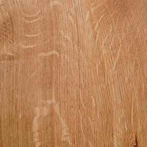 May include: Close-up of a section of light brown wood grain. The wood has a natural, textured appearance with visible grain patterns and knots. The wood's colour is a warm, natural tone.