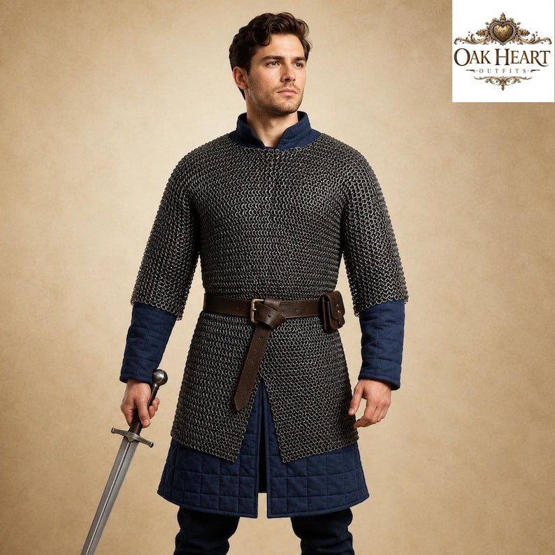 May include: A medieval-style chainmail shirt with a blue quilted undergarment and a brown leather belt. The outfit includes a sword and is from Oak Heart Outfits.